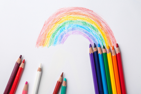 Drawing of rainbow and pencils, top viewの写真素材