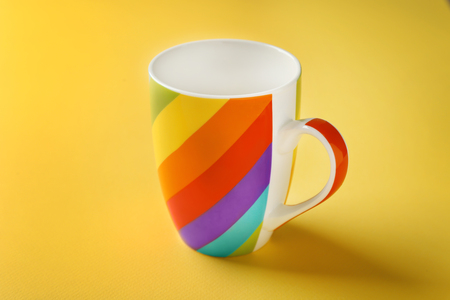 Rainbow cup on color backgroundの写真素材