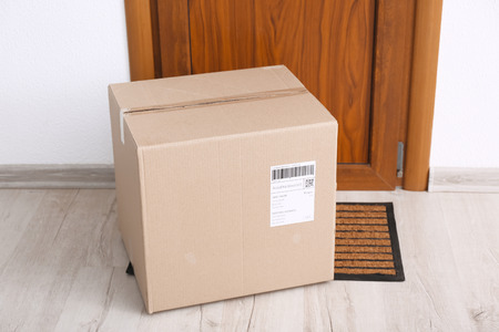 Parcel box on floor near door