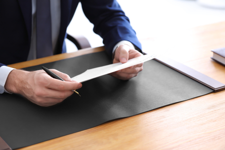 Male notary with document in office, closeupの写真素材