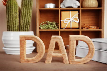 Word "Dad" made of wooden letters on table. Father's Day celebrationの写真素材