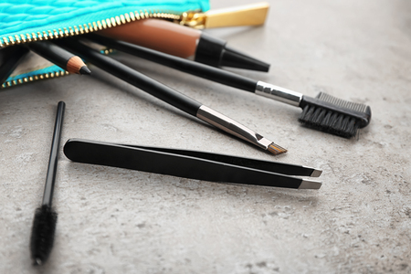 Set of tools for eyebrow dyeing and correction on grey backgroundの写真素材