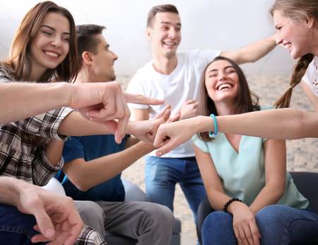 People having fun together indoors. Unity concept
