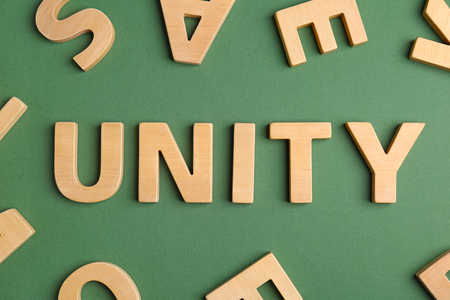 Word UNITY made of letters on color backgroundの写真素材