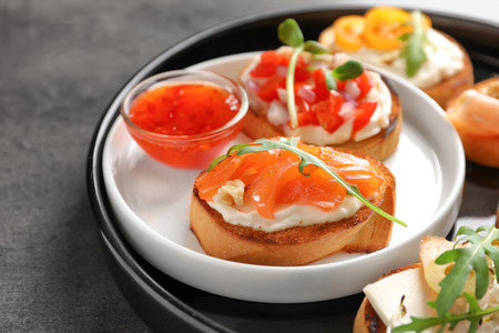 Tasty fresh bruschettas on plateの写真素材