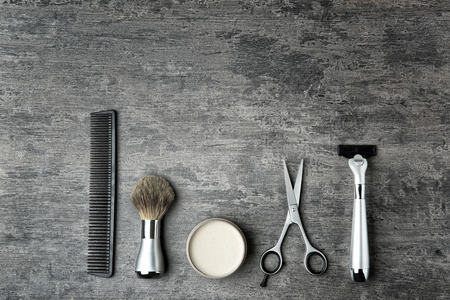 Professional hairdresser set for men on gray table, top viewの写真素材