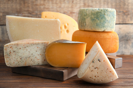 Different kinds of delicious cheese on tableの写真素材