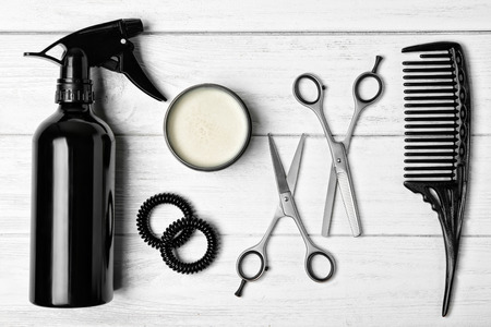 Professional hairdresser set on wooden tableの写真素材