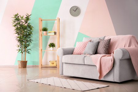 Living room interior with comfortable couch and soft pillowsの写真素材