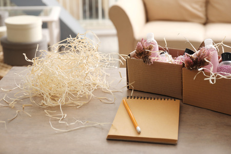 Preparing parcels for shipment to customer on table