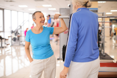 Elderly people in modern gym