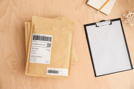 Preparing parcels for shipment to customer on table