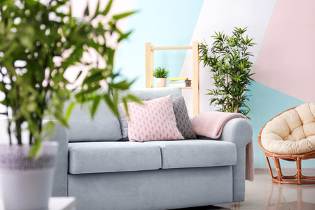 Living room interior with comfortable couch and soft pillowsの写真素材