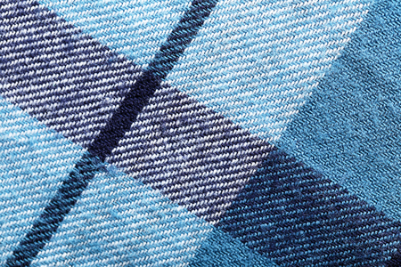 Plaid cotton fabric texture as background, closeup