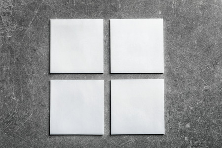 Blank sheets of paper on grey background. Mock up for designの写真素材