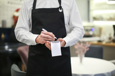 Waiter taking order indoors, closeupの写真素材