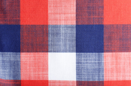 Plaid cotton fabric texture as background, closeup