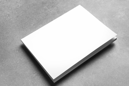 Book with blank cover on grey background. Mock up for designの写真素材
