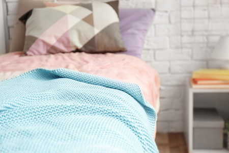 Bed with pillows in modern children roomの写真素材