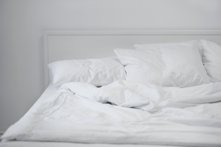 Comfortable bed with soft pillows, closeupの写真素材