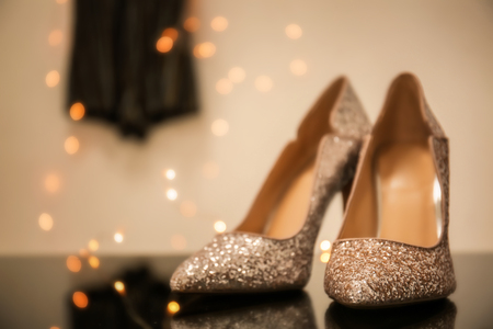 Pair of sparkly female shoes on blurred backgroundの写真素材