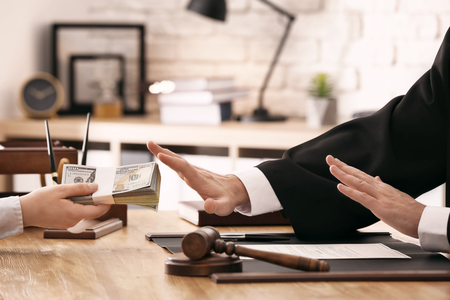 Judge refusing to take bribe from woman, closeupの写真素材