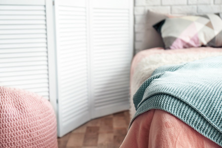 Bed with pillows in modern children roomの写真素材