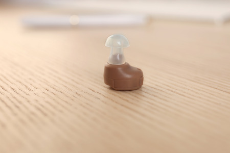 Hearing aid on table, closeup