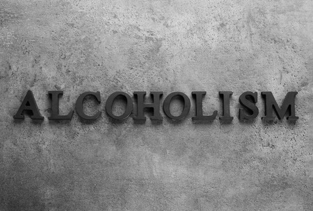 Word "Alcoholism" on grey backgroundの写真素材