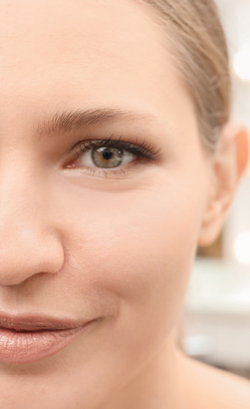 Young woman with natural eyebrows, closeupの写真素材