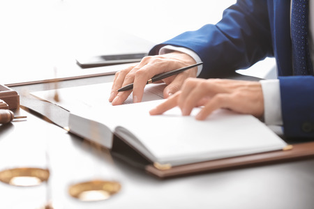 Male lawyer working in office, closeup