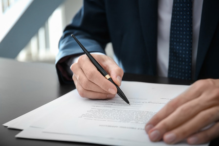 Male lawyer working in office, closeup
