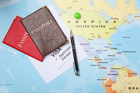 Passports and pen on map. Approved American visaの写真素材
