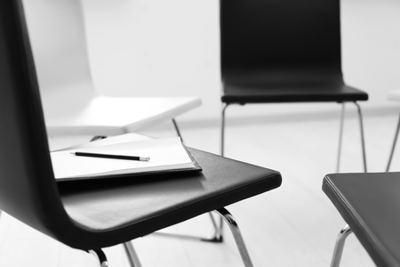 Black and white chairs in empty room for group therapyの写真素材