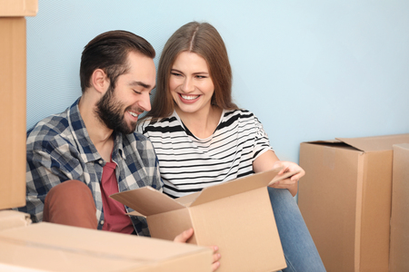 Young couple in their new house. Moving dayの写真素材
