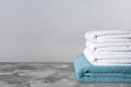 Stack of clean towels on tableの写真素材