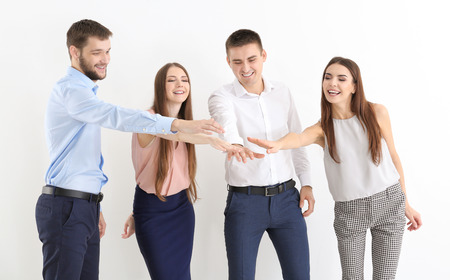 People putting hands together on white background. Unity concept