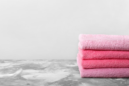 Stack of clean towels on tableの写真素材