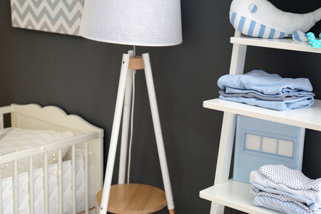 Children's room interior with crib and shelving unit, closeupの写真素材