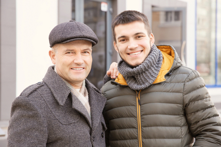 Mature man with his son outdoorsの写真素材
