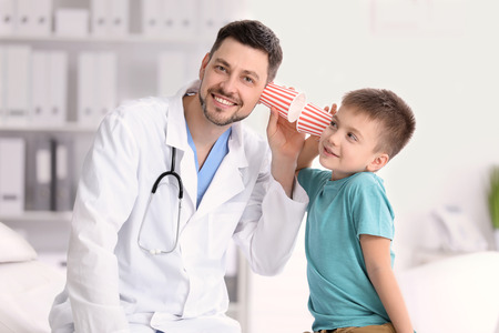 Children's doctor with little boy in hospitalの写真素材
