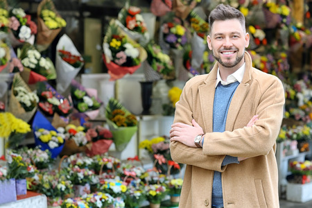 Business owner near his store with flowersの写真素材