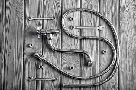 Plumber's tools on wooden backgroundの写真素材