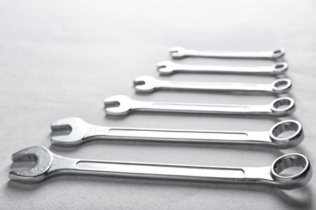 Plumber's tools on light background