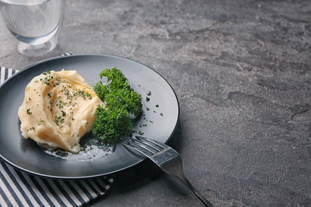 Plate with mashed potatoes on tableの写真素材