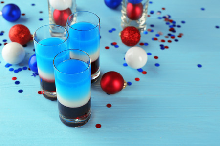 Layered cocktails in colors of American flag on tableの写真素材