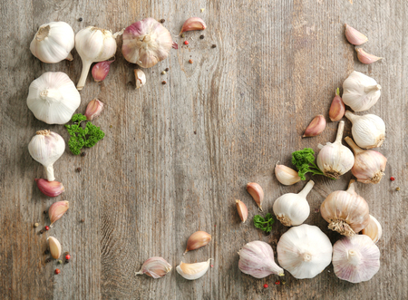 Composition with garlic on wooden backgroundの写真素材