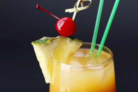 Glass of Sex on the Beach cocktail against dark background, closeupの写真素材