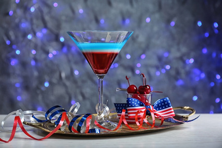 Layered cocktail in colors of American flag on tableの写真素材