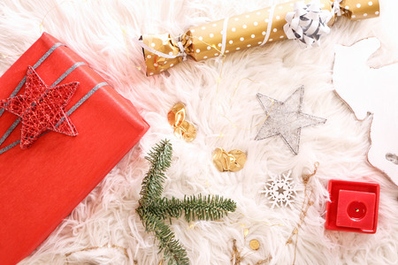 Gifts and Christmas decorations on furの写真素材